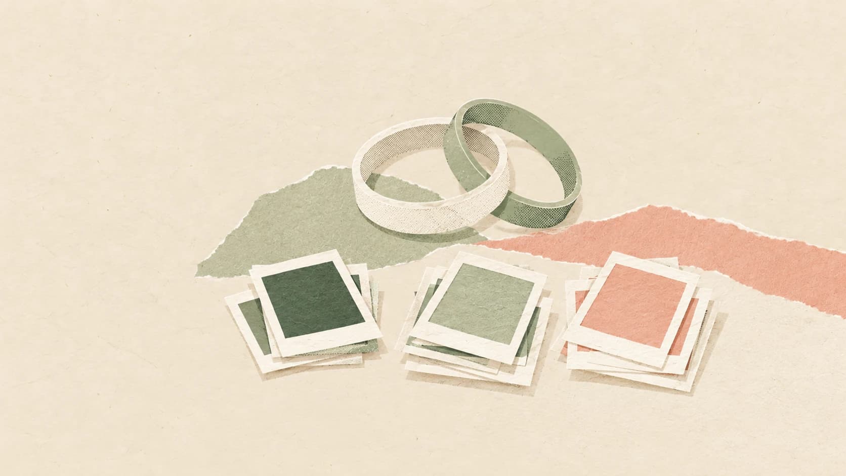 Paper wedding rings above blank photo frames arranged into separate piles.